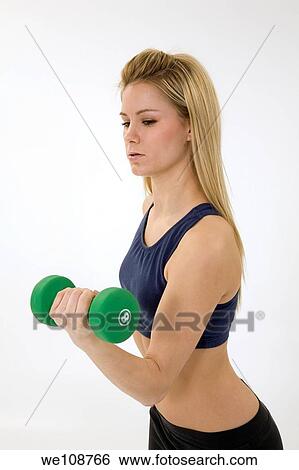Young caucasian woman working out View Large Photo Image Stock Photograph - Young caucasian woman working out. Fotosearch