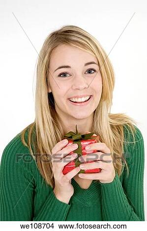 Young woman excited after recieving a special gift View Large Photo Image Picture - Young woman excited after recieving a special gift. Fotosearch