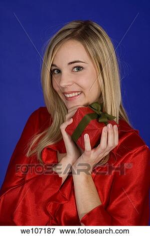 Young woman excited after recieving a special gift View Large Photo Image Stock Photo - Young woman excited after recieving a special gift. Fotosearch