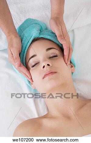 Young woman having a relaxing moment during a message View Large Photo Image Stock Image - Young woman having a relaxing moment during a message. Fotosearch