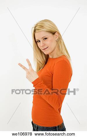 Young woman posing on white background with some attitude View Large Photo Image Stock Photo - Young woman posing on white background with some attitude. Fotosearch