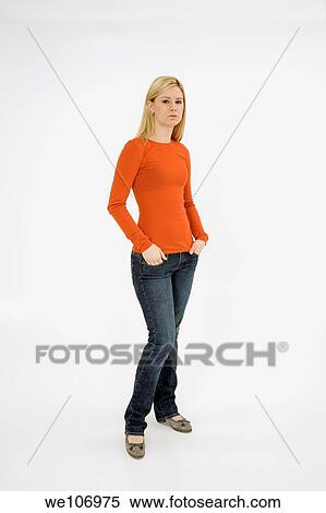 Stock Photography - Young woman posing on white background with some attitude. Fotosearch