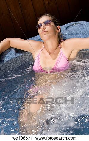 Young woman relaxing in Hottub View Large Photo Image Stock Image - Young woman relaxing in Hottub. Fotosearch