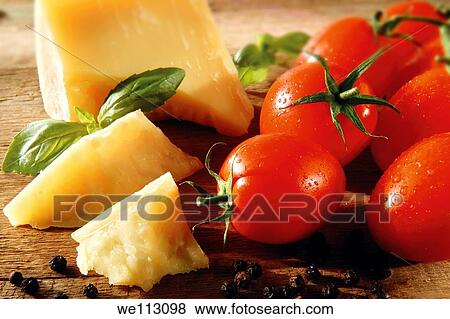 Cheddar cheese and fresh tomatoes View Large Photo Image Stock Photo - Cheddar cheese and fresh tomatoes. Fotosearch