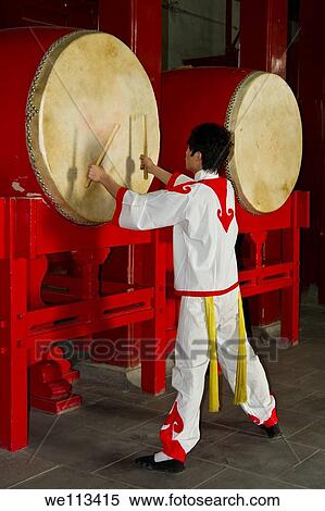 Chinese drummers performing at the Drum Tower in Beijing, China View Large Photo Image Stock Photography - Chinese drummers performing at the Drum Tower in Beijing, China. Fotosearch