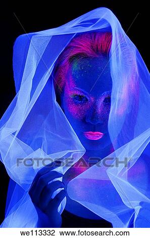 Face of woman in the dark with fluorescent paint makeup wearing a white veil under black lights View Large Photo Image Stock Image - Face of woman in the dark with fluorescent paint makeup wearing a white veil under black lights. Fotosearch