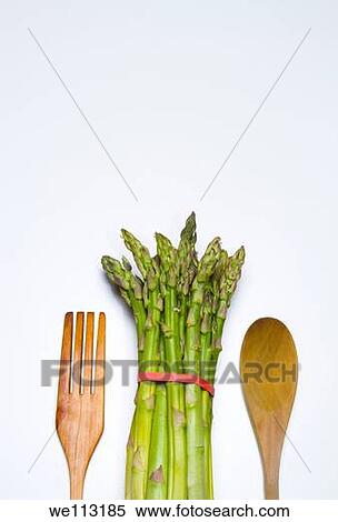 fresh wild asparagus on a table with cutlery View Large Photo Image Stock Photography - fresh wild asparagus on a table with cutlery. Fotosearch