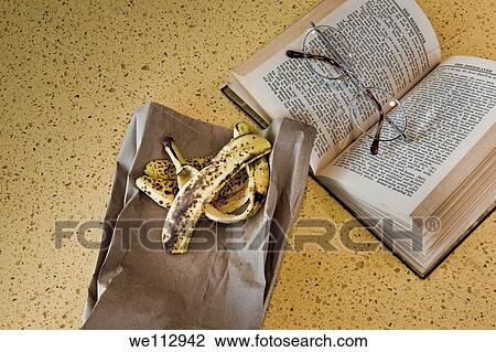 Glasses, book, and a banana peel View Large Photo Image Stock Image - Glasses, book, and a banana peel. Fotosearch