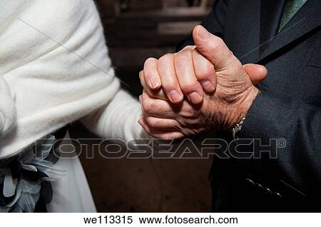 Stock Photography - Holding hands in support. Fotosearch