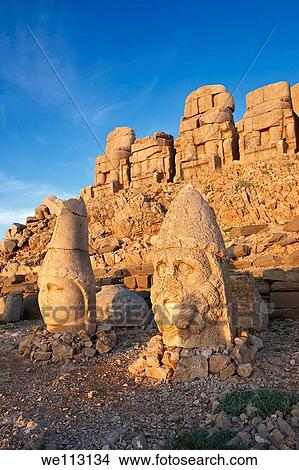 Image of the statues of around the tomb of Commagene King Antochus 1 on the top of Mount Nemrut, Turkey Stock photos & Photo art prints In 62 BC, King Antiochus I Theos of Commagene built on the mountain top a tomb-sanctuary flanked by huge statues 8? 9 View Large Photo Image Picture - Image of the statues of around the tomb of Commagene King Antochus 1 on the top of Mount Nemrut, Turkey Stock photos & Photo art prints In 62 BC, King Antiochus I Theos of Commagene built on the mountain top a tomb-sanctuary flanked by huge statues 8? 9. Fotosearch