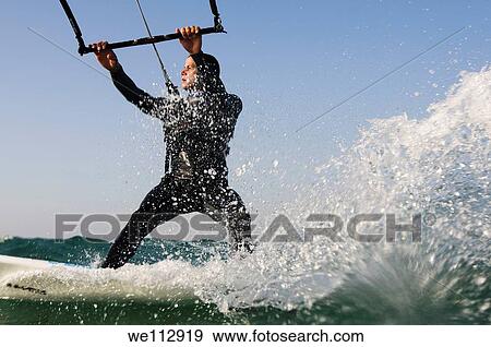Kitesurfing in the Mediterranean sea Photographed from within the water View Large Photo Image Stock Photo - Kitesurfing in the Mediterranean sea Photographed from within the water. Fotosearch