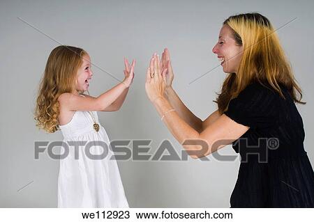 Mother and daughter of 3 playing View Large Photo Image Stock Image - Mother and daughter of 3 playing. Fotosearch