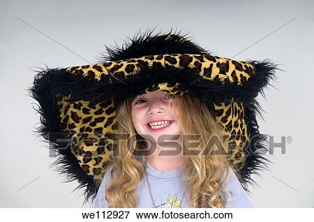 Smiling young girl of three with leopard fur hat View Large Photo Image Stock Photo - Smiling young girl of three with leopard fur hat. Fotosearch