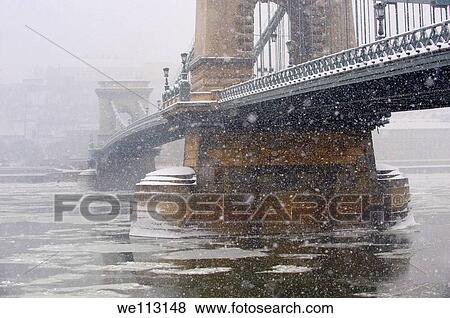 South side of yhe Szechenyi Lanchid Chain Bridge in the winter snow looking towards the castle district Budapest Hungary stock photos View Large Photo Image Stock Photo - South side of yhe Szechenyi Lanchid Chain Bridge in the winter snow looking towards the castle district Budapest Hungary stock photos. Fotosearch
