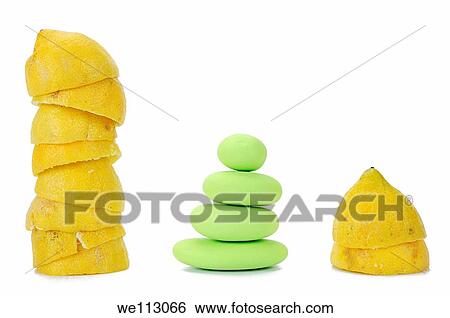 Stacks of squeezed yellow citrus halves and green pebbles, on white background, studio shot View Large Photo Image Stock Photograph - Stacks of squeezed yellow citrus halves and green pebbles, on white background, studio shot. Fotosearch