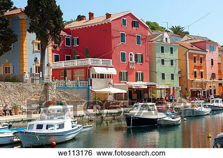 Stock Photograph - The Picturesque fishing harbour of Veli Lo? inj, Lo? inj Island, Croati. Fotosearch
