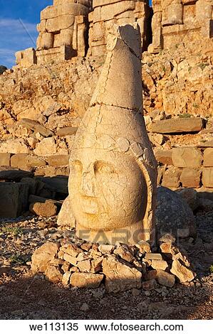the statues of around the tomb of Commagene King Antochus 1 on the top of Mount Nemrut, Turkey Stock photos & Photo art prints In 62 BC, King Antiochus I Theos of Commagene built on the mountain top a tomb-sanctuary flanked by huge statues 8? 9 m/26? 30 ft View Large Photo Image Stock Photography - the statues of around the tomb of Commagene King Antochus 1 on the top of Mount Nemrut, Turkey Stock photos & Photo art prints In 62 BC, King Antiochus I Theos of Commagene built on the mountain top a tomb-sanctuary flanked by huge statues 8? 9 m/26? 30 ft. Fotosearch