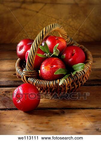 Stock Image - Whole fresh red plums. Fotosearch
