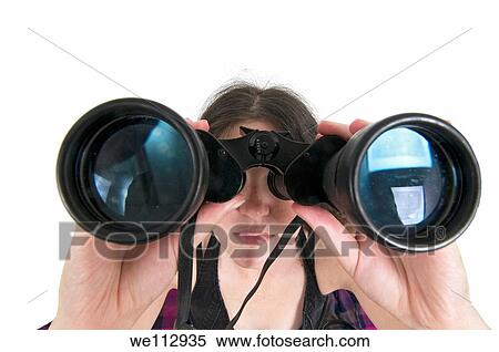 Woman looks through a binoculars facing camera wide angle view View Large Photo Image Stock Photography - Woman looks through a binoculars facing camera wide angle view. Fotosearch