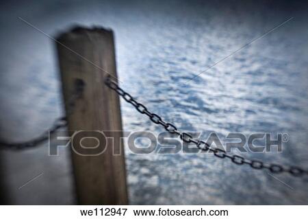 Wooden beam and metal chains from a pier View Large Photo Image Stock Photo - Wooden beam and metal chains from a pier. Fotosearch
