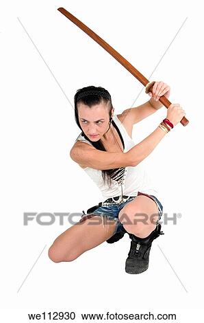 Young punk teen girl wielding a bokken a wooden Japanese sword used for practice View Large Photo Image Stock Image - Young punk teen girl wielding a bokken a wooden Japanese sword used for practice. Fotosearch