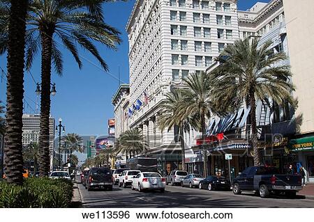 Stock Photograph - Cars on Canal Street in front of the Ritz Carlton Hotel in downtown New Orleans, Louisiana. Fotosearch