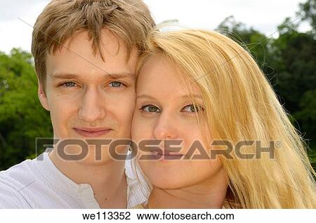 Cheek to cheek loving couple of white Eastern European desent View Large Photo Image Stock Image - Cheek to cheek loving couple of white Eastern European desent. Fotosearch