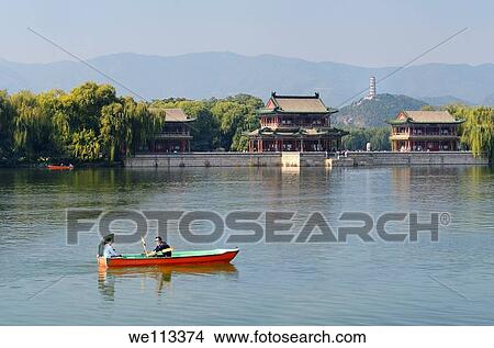 Couple rowing past the Pavilion of Bright Scenery with Jade Peak Pagoda on Kunming Lake Summer Palace Beijing View Large Photo Image Picture - Couple rowing past the Pavilion of Bright Scenery with Jade Peak Pagoda on Kunming Lake Summer Palace Beijing. Fotosearch