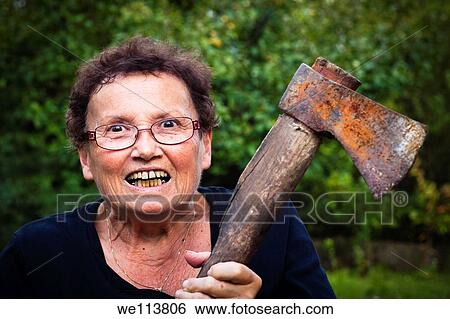 Crazy senior woman holding axe View Large Photo Image Stock Photograph - Crazy senior woman holding axe. Fotosearch