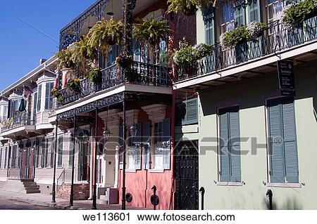 Creole townhouses with ornate wrought iron balcony and hanging planters and window boxes in the French Quarter of New Orleans, Louisiana View Large Photo Image Stock Image - Creole townhouses with ornate wrought iron balcony and hanging planters and window boxes in the French Quarter of New Orleans, Louisiana. Fotosearch