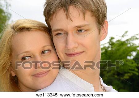Stock Photography - Faces of a happy couple of white Eastern European desent. Fotosearch
