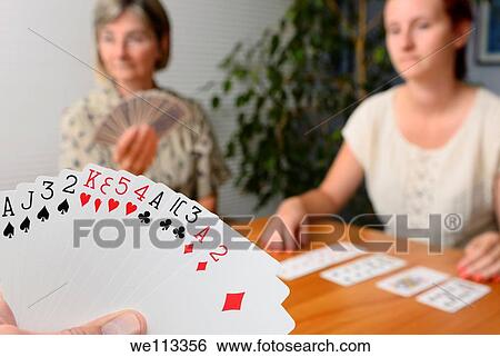 Family foursome playing Contract Bridge at home View Large Photo Image Stock Photograph - Family foursome playing Contract Bridge at home. Fotosearch