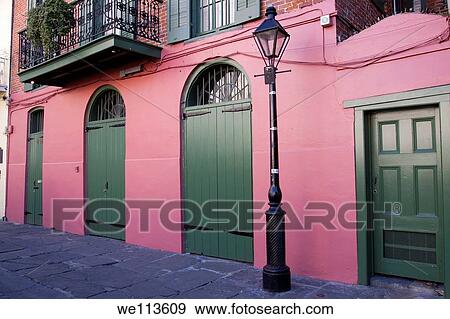 Stock Photo - Famous lamppost on Pirate Alley by the Cabildo in French Quarter of New Orleans. Fotosearch