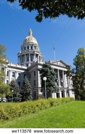 Stock Photo - Gold dome and flag above Colorado state capitol building in Denver. Fotosearch