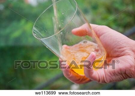 Man´s hand serving cider. Asturias, Spain. View Large Photo Image Stock Photo - Man´s hand serving cider. Asturias, Spain.. Fotosearch