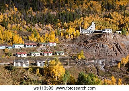 Mining town in Rocky Mountains of Colorado with simple houses on hillside with aspen trees in autumn View Large Photo Image Stock Image - Mining town in Rocky Mountains of Colorado with simple houses on hillside with aspen trees in autumn. Fotosearch