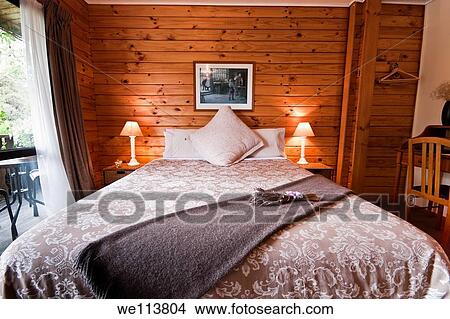 Nice warm bedroom interior of mountain lodge Fox Glacier Lodge, Fox Glacier, West Coast, South Island, New Zealand View Large Photo Image Picture - Nice warm bedroom interior of mountain lodge Fox Glacier Lodge, Fox Glacier, West Coast, South Island, New Zealand. Fotosearch