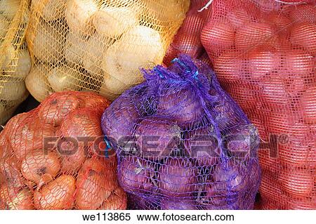 Onions in net bags View Large Photo Image Stock Photography - Onions in net bags. Fotosearch