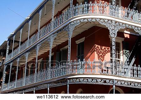 Stock Image - Ornate wrought iron balcony railing of the Royal Sonesta Hotel in the French Quarter of New Orleans. Fotosearch