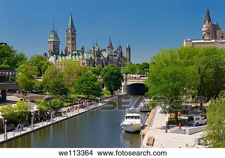 Overview of the Ottawa Parliament Buildings Rideau Canal National Arts Centre and Chateau Laurier View Large Photo Image Picture - Overview of the Ottawa Parliament Buildings Rideau Canal National Arts Centre and Chateau Laurier. Fotosearch