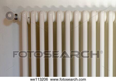 Radiator on white wall View Large Photo Image Stock Photograph - Radiator on white wall. Fotosearch
