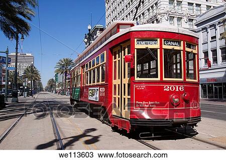 Red trolley car on the track on Canal Street in downtown New Orleans, Louisiana View Large Photo Image Stock Image - Red trolley car on the track on Canal Street in downtown New Orleans, Louisiana. Fotosearch