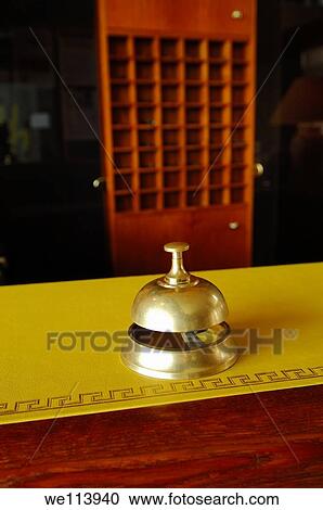 Stock Image - Service ring bell on a hotel desk. Fotosearch