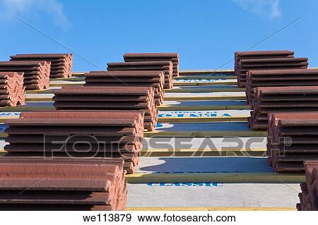 Stacks of roof tiles ready to lay View Large Photo Image Stock Photo - Stacks of roof tiles ready to lay. Fotosearch