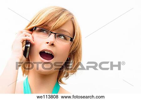 Surprised young business woman on phone, isolated on white background View Large Photo Image Stock Photo - Surprised young business woman on phone, isolated on white background. Fotosearch