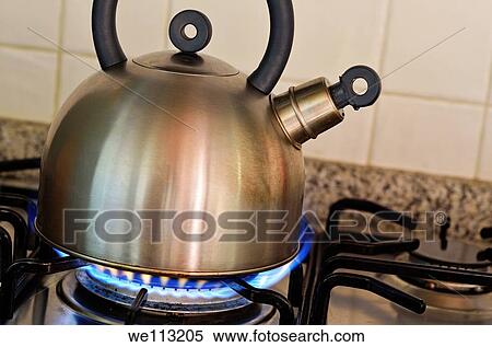 Teapot on gas stove burner View Large Photo Image Stock Photography - Teapot on gas stove burner. Fotosearch