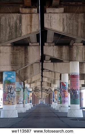 Stock Photo - Underneath a highway overpass with artistically decorated pillars in New Orleans. Fotosearch