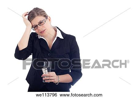 Unhappy young woman with headache holding glass with water and painkillers Isolated on white background View Large Photo Image Stock Photograph - Unhappy young woman with headache holding glass with water and painkillers Isolated on white background. Fotosearch