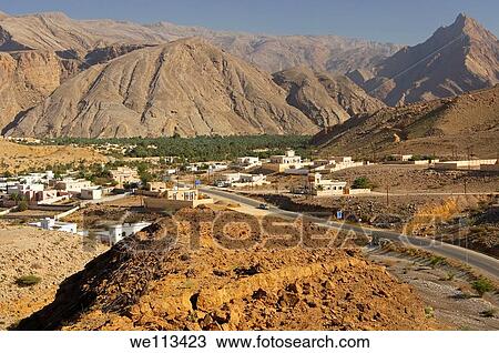 Village at the foot of the barren mountain range of the Al Hajar Mountains, Sultanate of Oman View Large Photo Image Stock Image - Village at the foot of the barren mountain range of the Al Hajar Mountains, Sultanate of Oman. Fotosearch