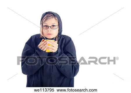 Stock Photography - Woman in winter jacket holding mug with hot drink, isolated on white background. Fotosearch